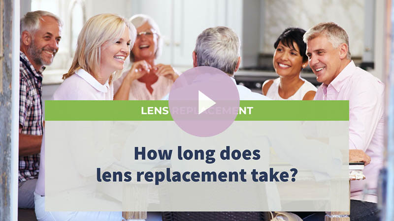 A group of middle-aged friends laughing while waiting for food in a restaurant.